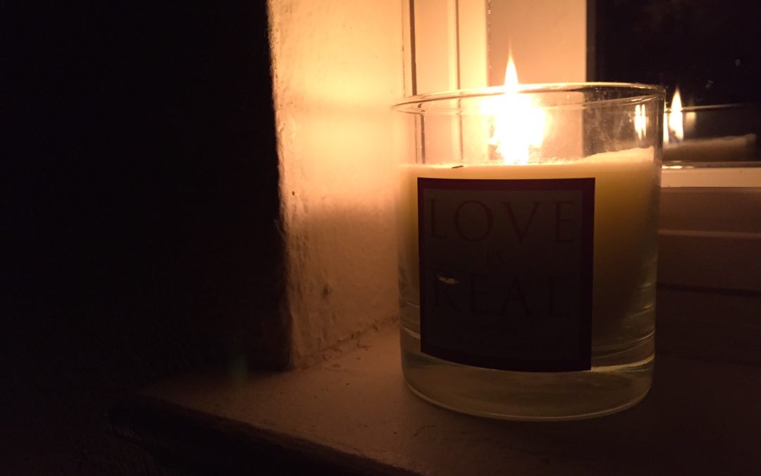 Dragonfly Yoga retreat and classes candle in window